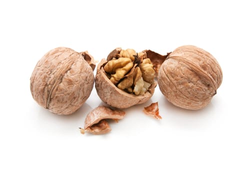 walnut and a cracked walnut isolated on the white background 