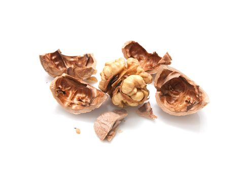 Crushed walnuts on white background 
