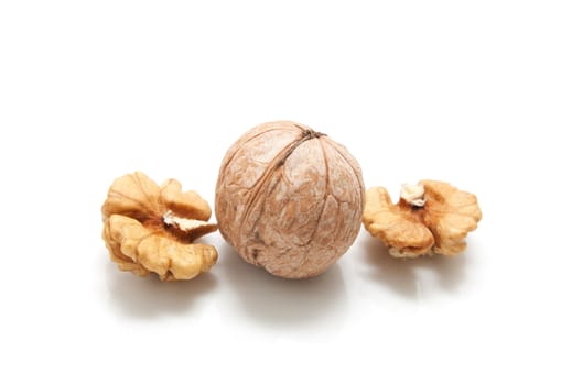 Crushed walnuts on white background 