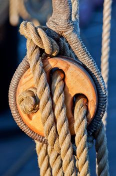Close up wooden block and ropes