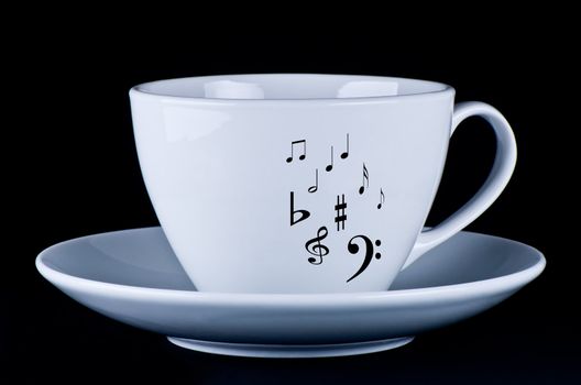 White mug with black musical notes  black background