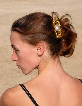 young woman and her beautiful hairstyle for ceremony