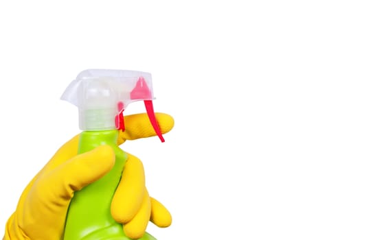 Hand in yellow glove with green sprayer