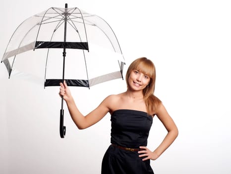 Young fashionable woman smile and holding umbrella