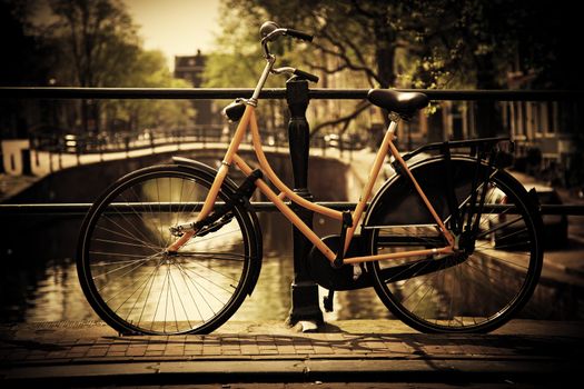 Amsterdam, Holland, Netherlands. Romantic canal bridge, retro bike. Old town