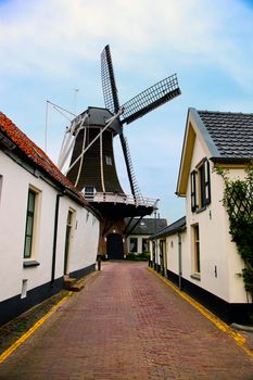 Windmill, historic architecture in small village in Holland, Netherlands