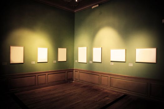 Art gallery, museum. Picture frames with blank empty white inside.