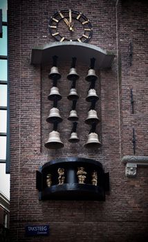 Amsterdam, Holland, Netherlands old town bells clock. Taksteeg street