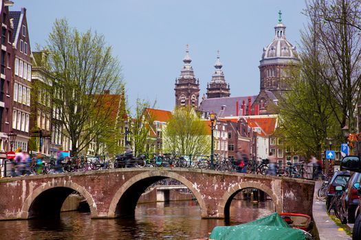 Amsterdam, Holland, Netherlands. Church of St Nicholas, old town canal, boats.