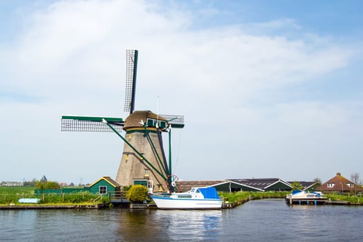 A traditional Dutch windmill near the canal. Netherlands