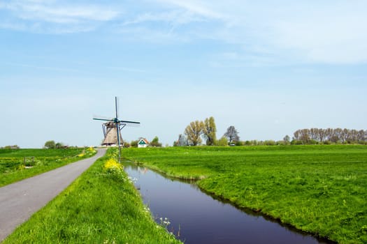 A traditional Dutch windmill near the canal. Netherlands