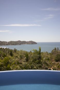 Mexican villa with beach view and a swimming pool.