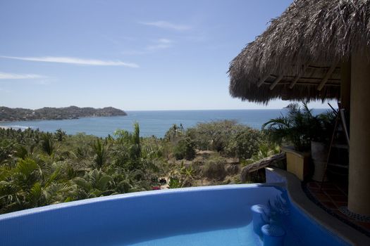 Mexican villa with beach view and a swimming pool.