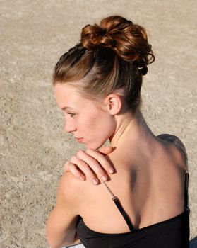 young woman and her beautiful hairstyle for ceremony