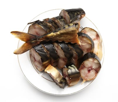 Smoked mackerel in a plate on a white background 