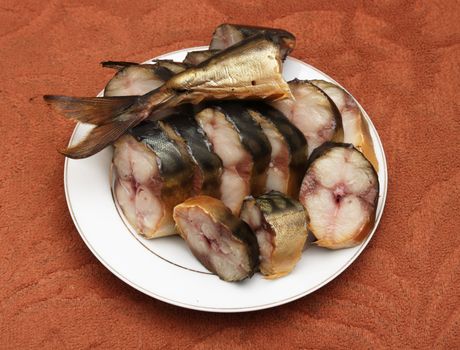 sliced ​​smoked mackerel on a plate