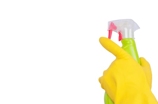 Hand in yellow glove with green sprayer