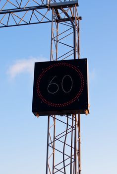 Electronic speed limit sign 60 on a highway