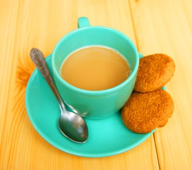 Cup coffee and liver on table from tree