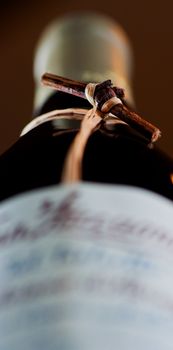 Wine bottle with grapevine shallow depth field