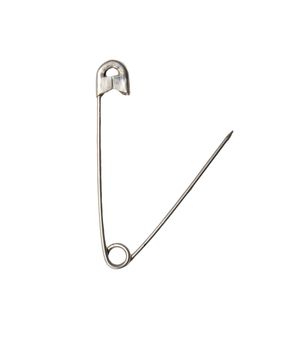 Closed safety pin. Cut out, on white background. Macro. On edge 