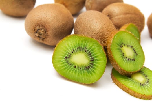 sliced and whole kiwi isolated on white background 