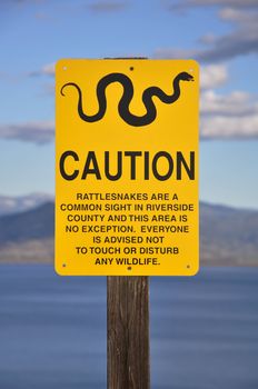 A sign warning of possible encounters with rattlesnakes is found at Diamond Valley Lake in Hemet, California.