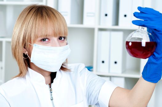 chemist working in the laboratory, mix liquid