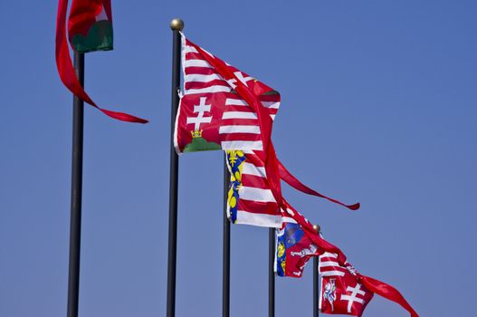 Historic flags on a bastion of a castle.