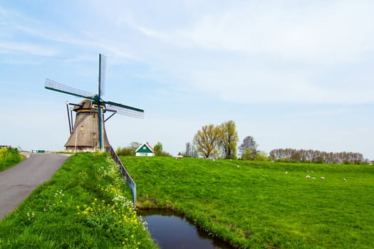 A traditional Dutch windmill near the canal. Netherlands