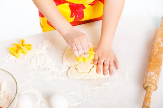 Beautiful hand boys making a cake, isolated on white background.