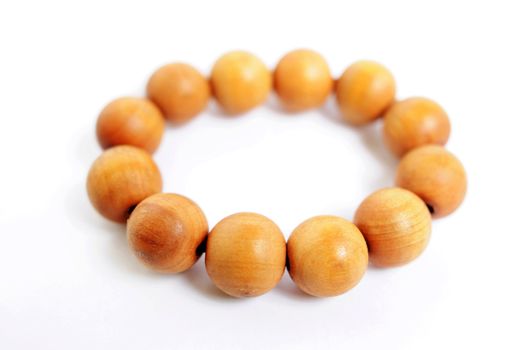 Wooden prayer beads on a white background