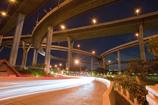 Architecture of Mega Bhumibol Industrial Ring Bridge at dusk in Thailand.