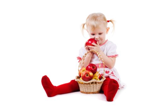 small girl with red apples