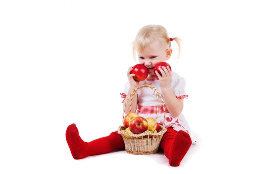 small girl with red apples