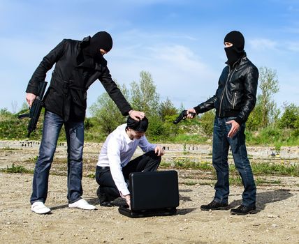 Two bandits kidnapped a businessman with a suitcase