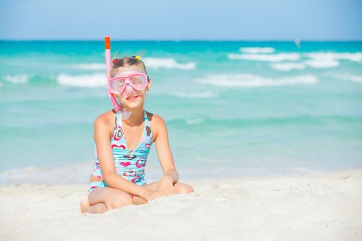 Portrait of a cute girl wearing a mask for diving background of the sea