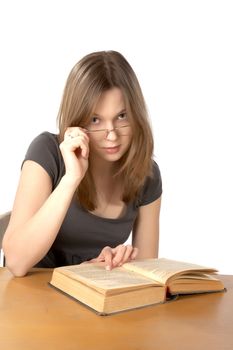 girl with glasses and the open book isolated on a white background