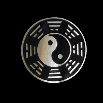 yin yang with trigrams over black