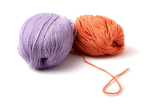 Balls of a multi-coloured yarn on  white background