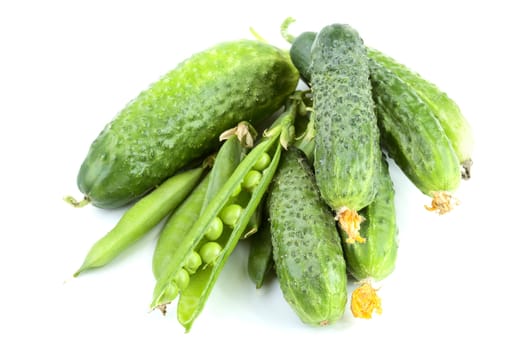 Green cucumbers and peas isolated on a white background