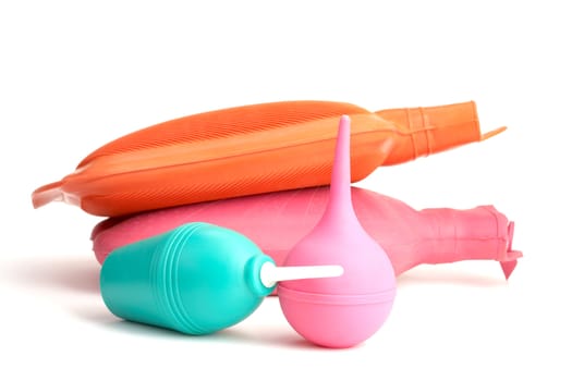 Medical hot-water bottle and colonic bulb for procedures on a white background