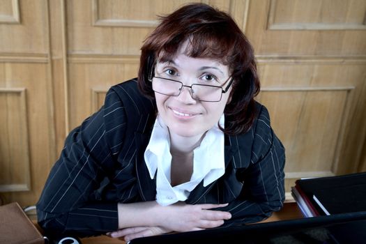 woman of average years in a business suit at office
