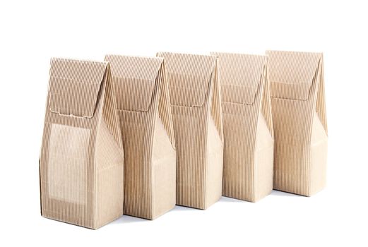 row of boxes from the goffered cardboard isolated on a white background