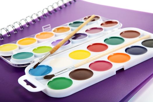 Water colour paints  brush albums for drawing on a table