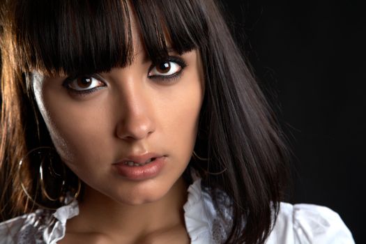 The person of the beautiful girl close up on a black background