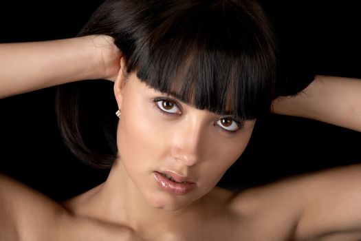 The person of the beautiful girl close up on a black background