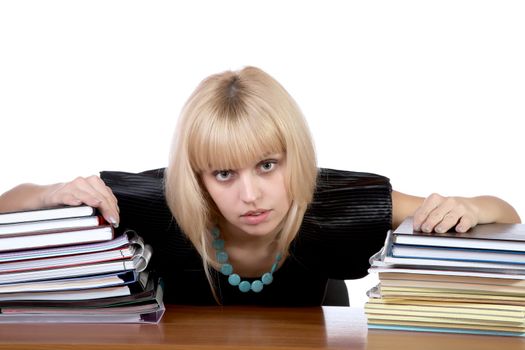girl with two piles of writing-books and notebooks on a white background