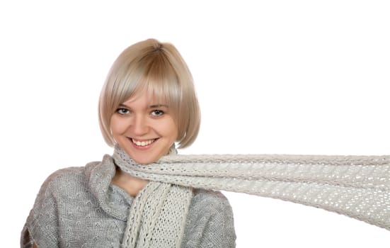 The smiling girl with a long scarf on a white background