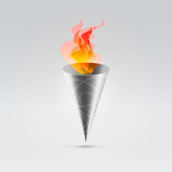 Fire flames burning in cone metal engraved torch over light background